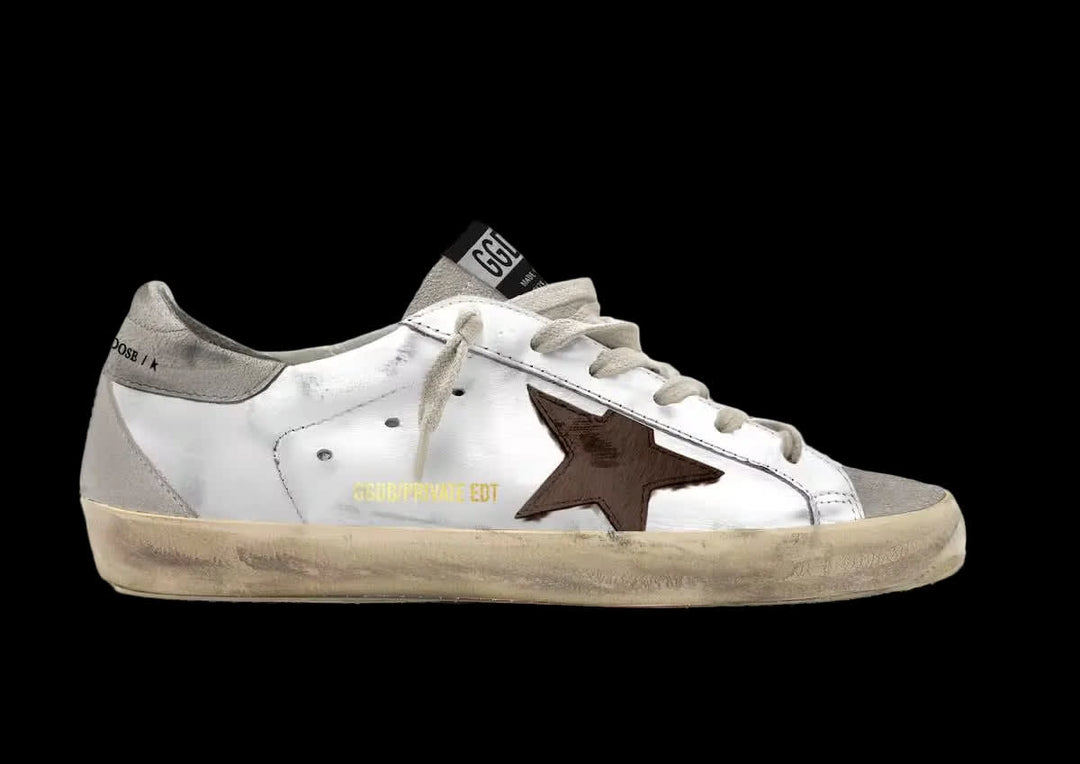Women's Super-Star in white leather with brown suede star and light grey suede inserts.