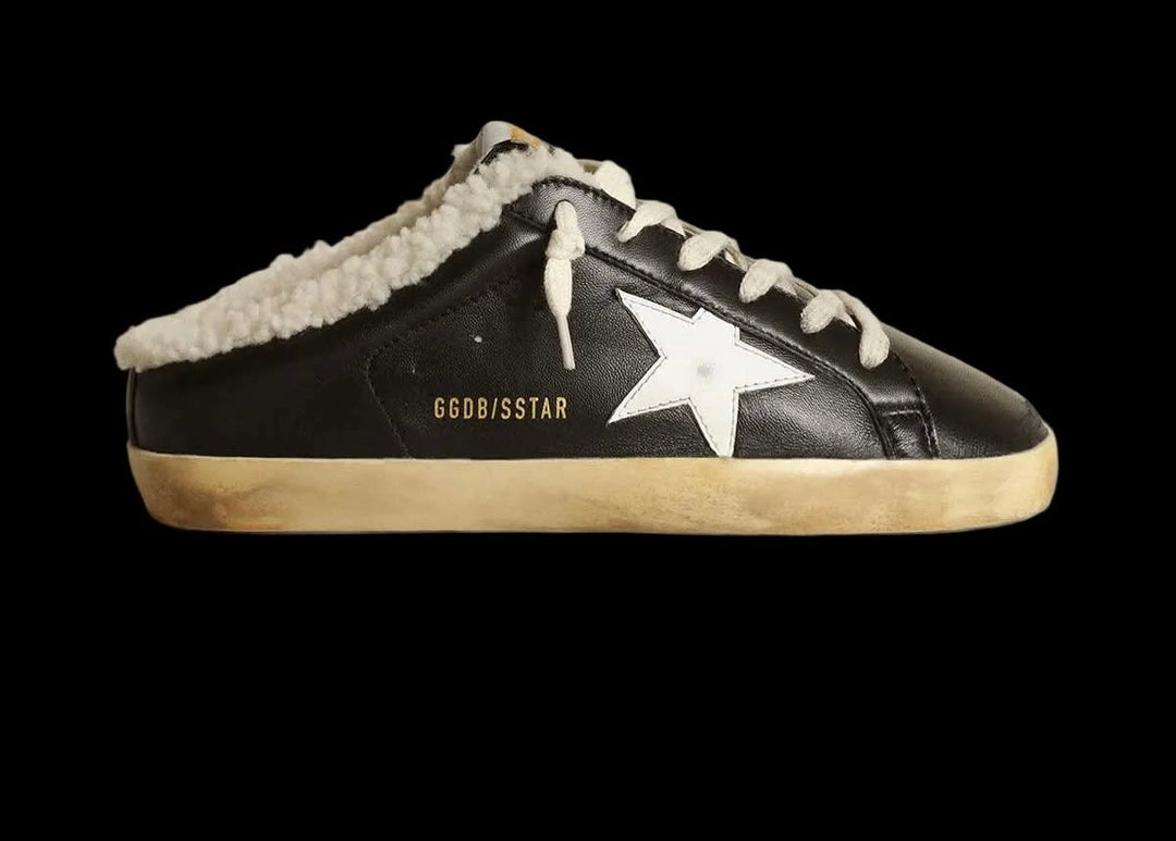Super-Star Sabots in black nappa leather with white leather star and beige shearling lining